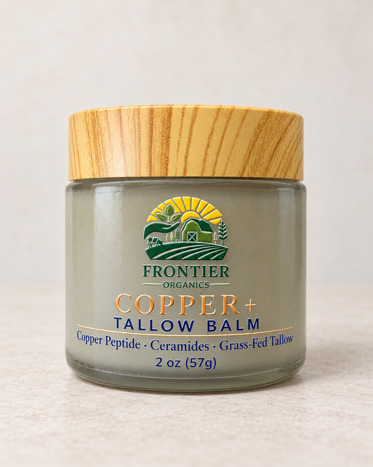 Frontier Organics Copper+ Tallow Balm in a 2 oz glass jar with bamboo lid